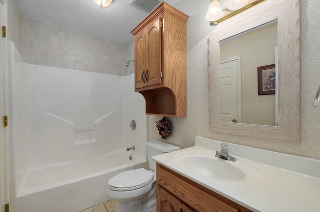 full bathroom featuring bathing tub / shower combination, tile patterned floors, a textured ceiling, toilet, and vanity