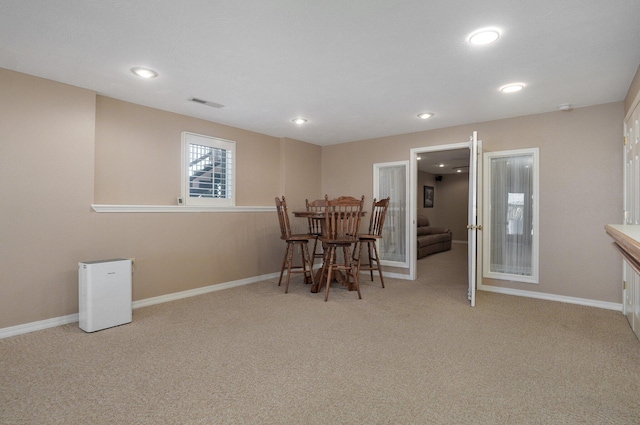 view of carpeted dining space