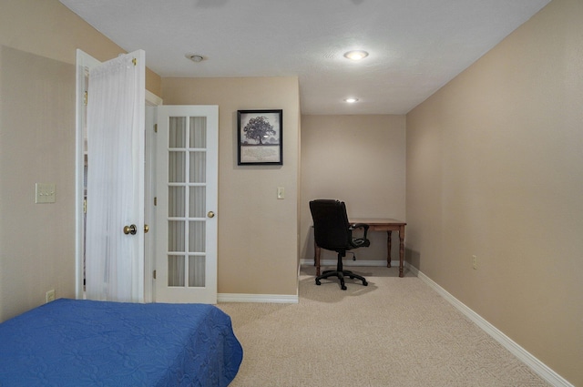 bedroom with light carpet