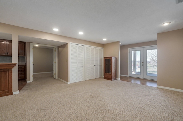 10071 W Farm Road 48, Walnut Grove, MO 65770 - unfurnished living room featuring light carpet, recessed lighting, and french doors