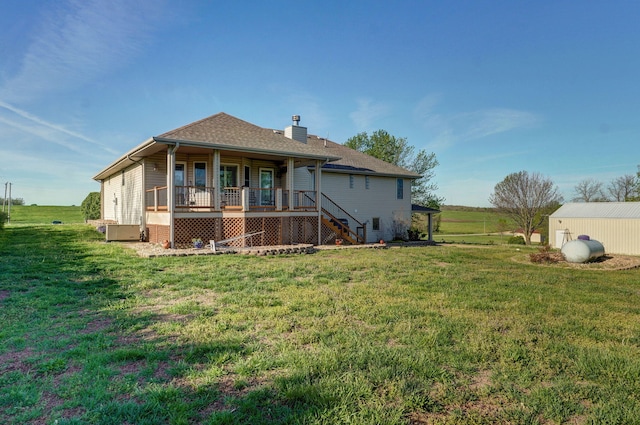 10071 W Farm Road 48, Walnut Grove, MO 65770 - rear view of house featuring covered porch, a yard, a chimney, and stairway