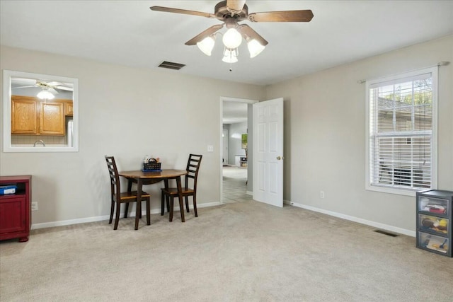 dining area with light carpet