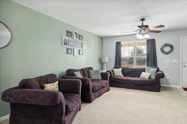 carpeted living room with a textured ceiling and ceiling fan