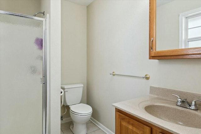 bathroom with tile patterned floors, toilet, vanity, and walk in shower