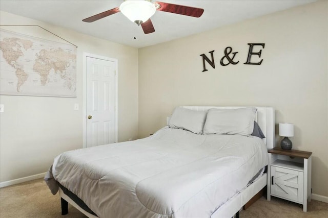 bedroom featuring ceiling fan and light carpet