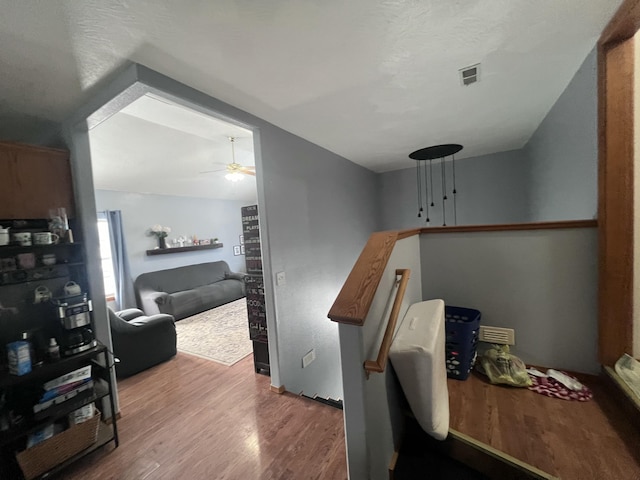 interior space with ceiling fan and hardwood / wood-style floors