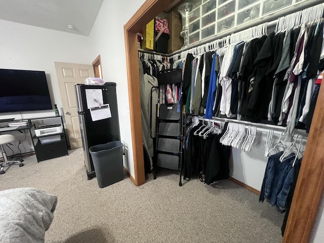 spacious closet with carpet flooring