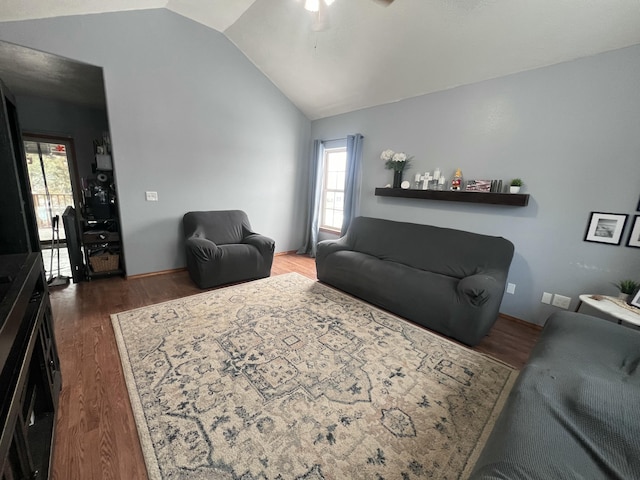 living room featuring vaulted ceiling and dark hardwood / wood-style floors