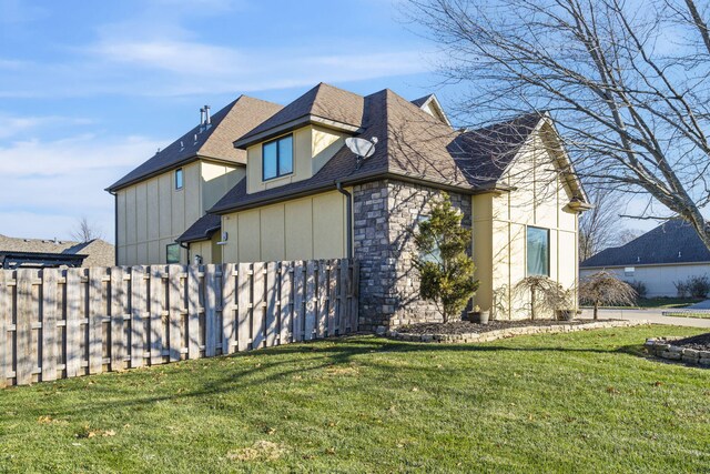 view of property exterior featuring a yard