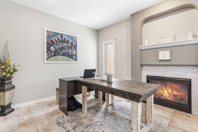 office with a tile fireplace