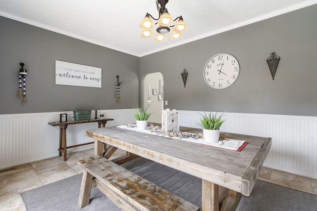 dining room featuring a notable chandelier and crown molding