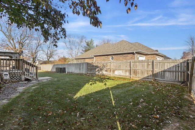 view of yard with a wooden deck