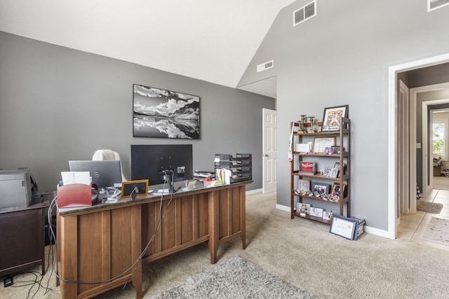 office featuring light colored carpet and vaulted ceiling