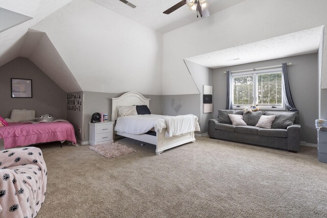 carpeted bedroom featuring a textured ceiling, ceiling fan, and vaulted ceiling