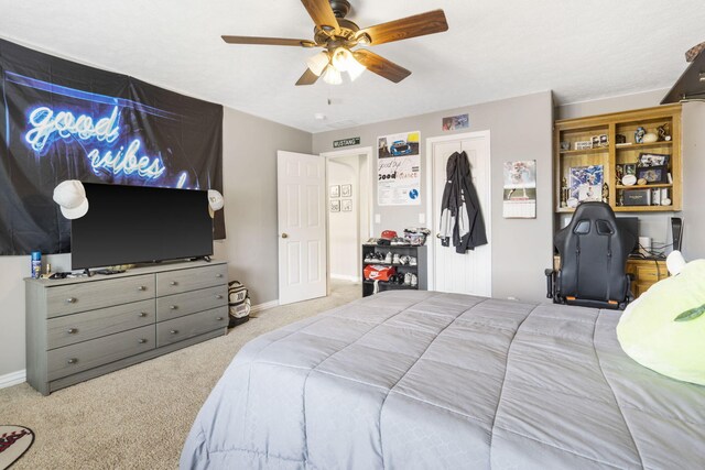 carpeted bedroom featuring ceiling fan