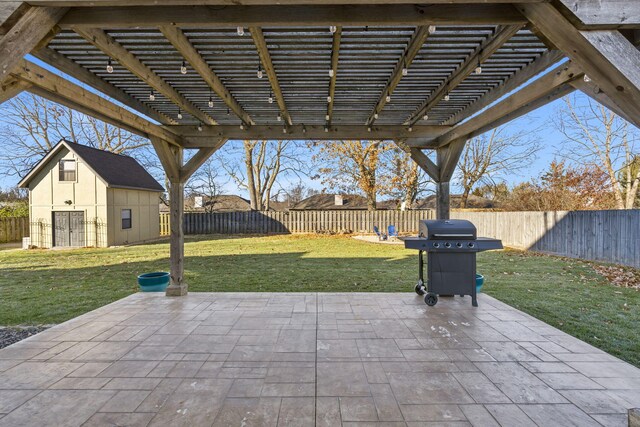 view of patio / terrace featuring a pergola, grilling area, and an outbuilding