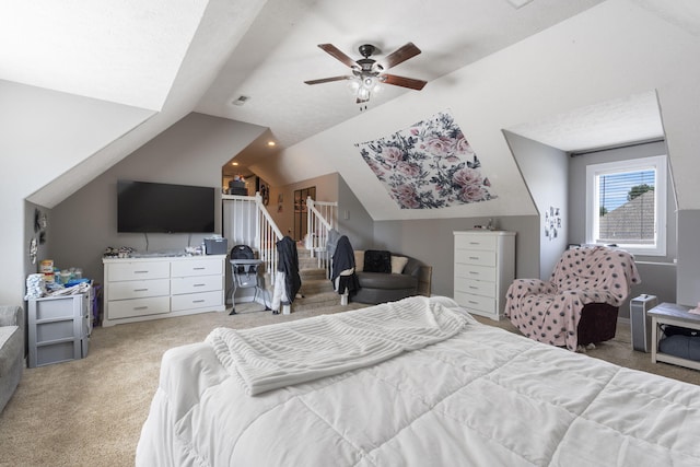 bedroom featuring ceiling fan, light carpet, and vaulted ceiling