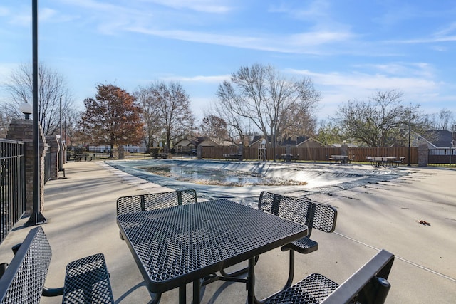 view of patio / terrace featuring a community pool