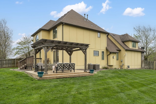 back of property with a pergola, a lawn, a patio, and a fenced backyard