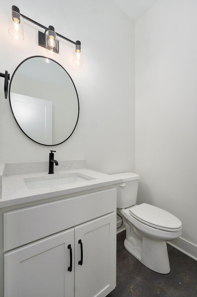 2423 E Cardinal St, Springfield, MO 65804 - bathroom with toilet, vanity, and baseboards