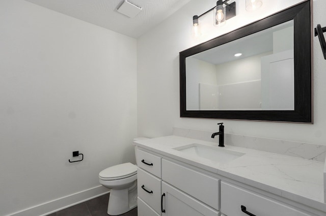 2423 E Cardinal St, Springfield, MO 65804 - bathroom with tile patterned flooring, vanity, baseboards, and toilet