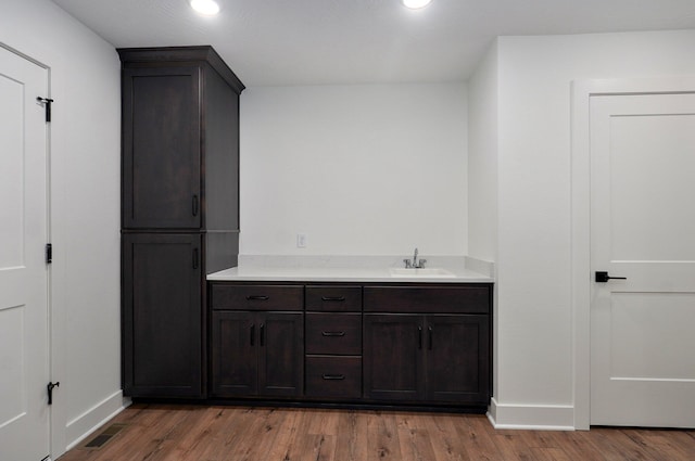2423 E Cardinal St, Springfield, MO 65804 - bathroom with wood finished floors, baseboards, visible vents, and recessed lighting