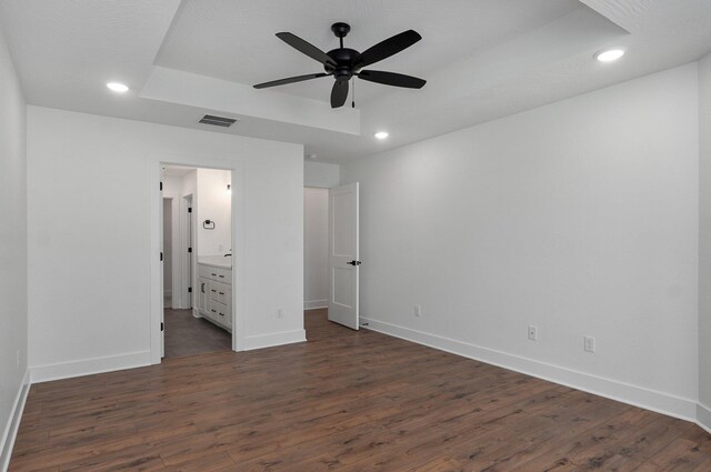 2423 E Cardinal St, Springfield, MO 65804 - unfurnished bedroom featuring dark wood-type flooring, visible vents, baseboards, and recessed lighting