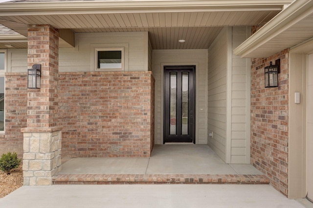2423 E Cardinal St, Springfield, MO 65804 - doorway to property featuring brick siding