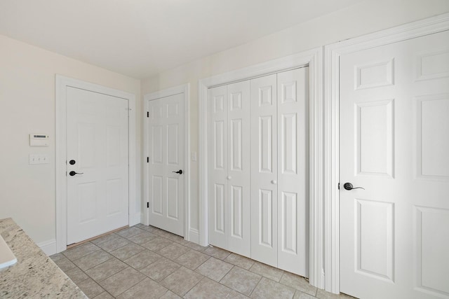 entryway featuring light tile patterned flooring