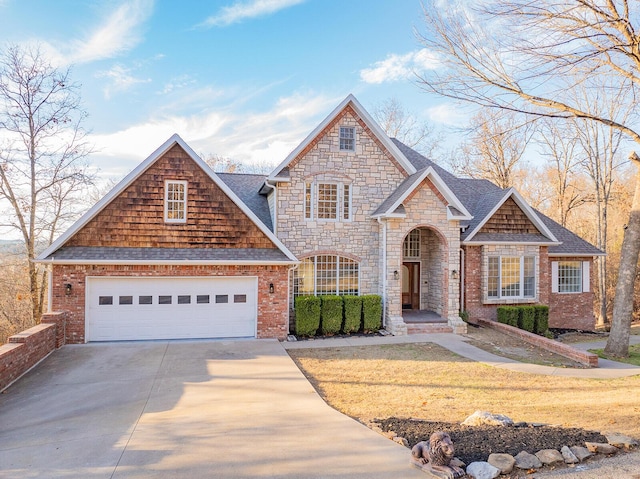 front of property featuring a front yard and a garage