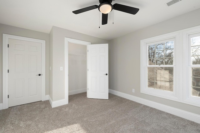 unfurnished bedroom with ceiling fan and light carpet