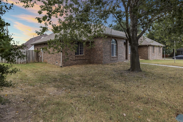 view of front of home with a yard