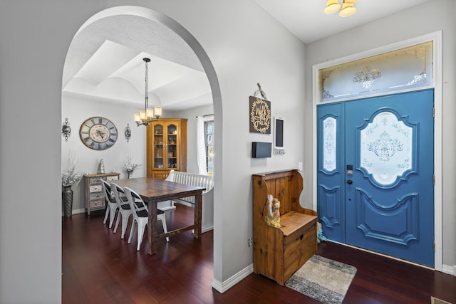 entrance foyer featuring a chandelier and dark hardwood / wood-style floors