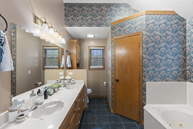 bathroom featuring tile patterned flooring, a bath, vanity, and toilet