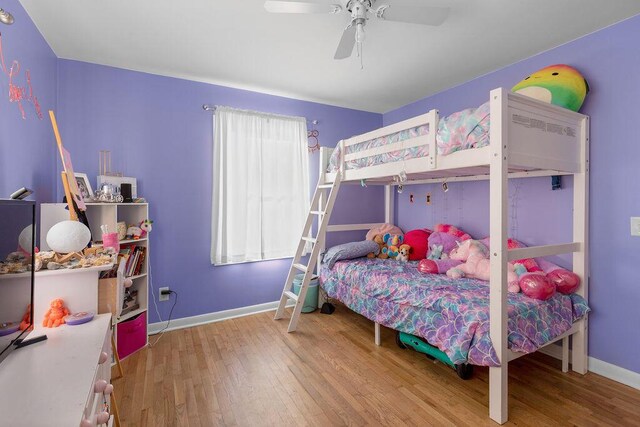 bedroom with ceiling fan and hardwood / wood-style floors