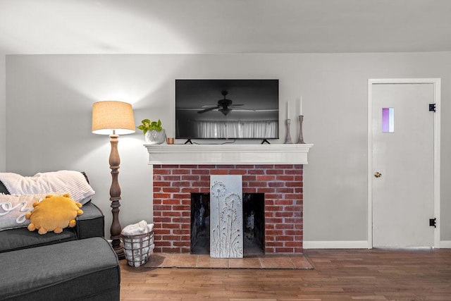 living room featuring hardwood / wood-style flooring and a fireplace