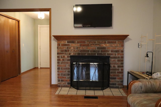 details featuring a fireplace and hardwood / wood-style floors