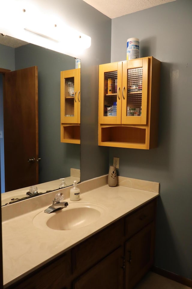 bathroom featuring vanity and a textured ceiling