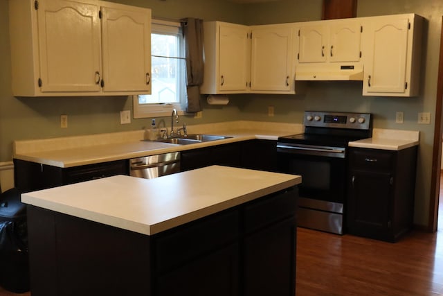 kitchen featuring stainless steel appliances, white cabinetry, dark hardwood / wood-style floors, and sink