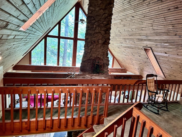 interior space with vaulted ceiling with skylight