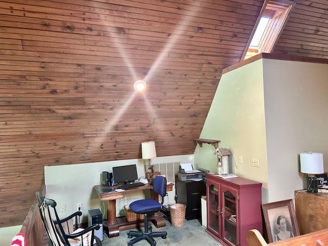 carpeted home office featuring wood ceiling and a skylight