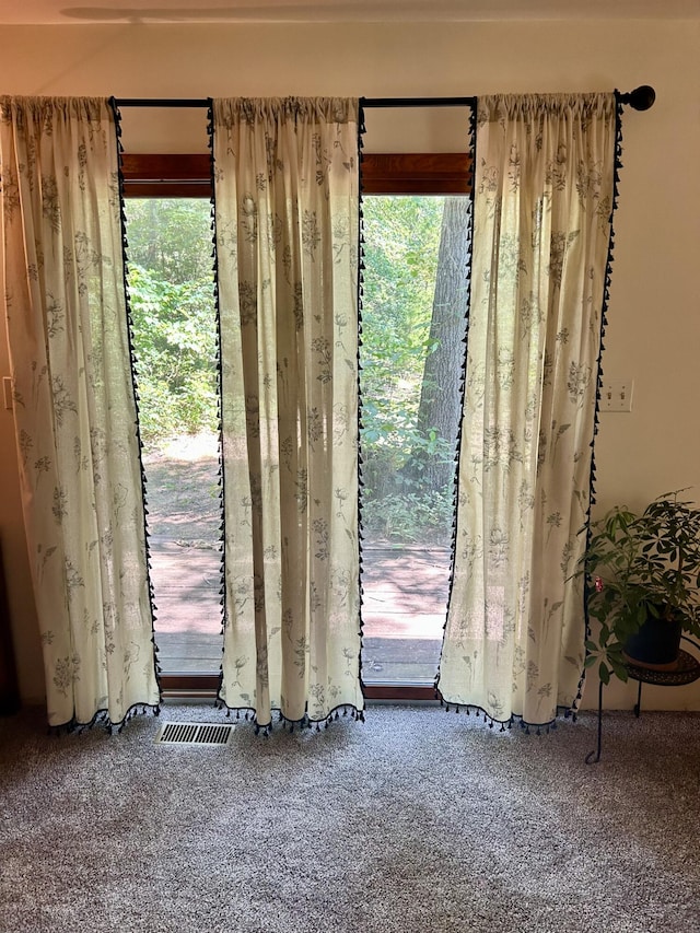 spare room with carpet and a healthy amount of sunlight