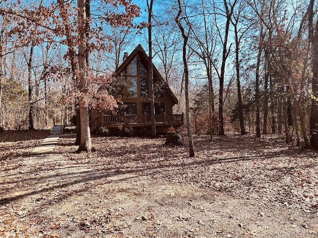 back of house featuring a wooden deck