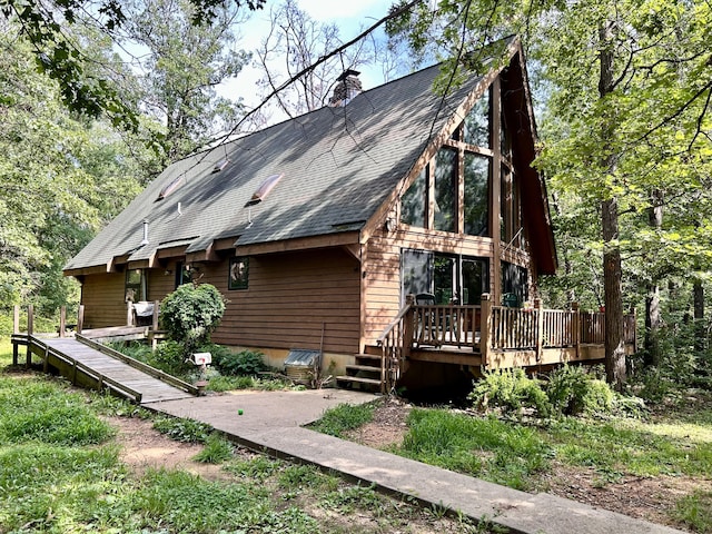 view of front of property with a wooden deck