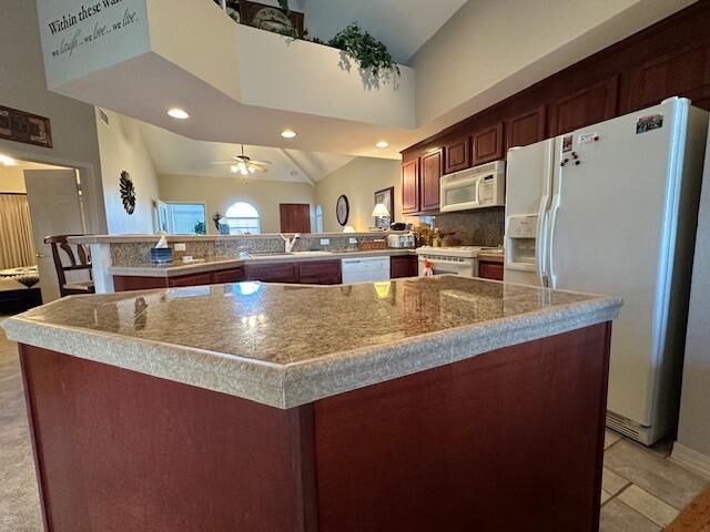 200 Glory Rd Unit C8, Branson, MO 65616 - kitchen featuring white appliances, recessed lighting, ceiling fan, a peninsula, and light tile patterned floors