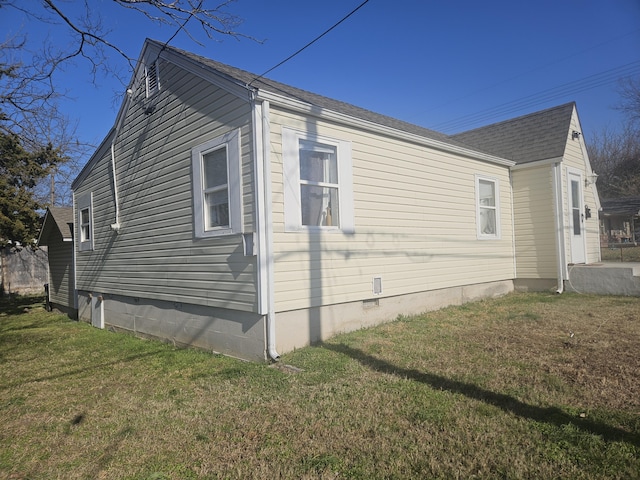 view of property exterior with a yard