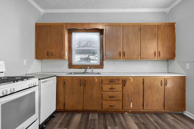 kitchen with crown molding, dark hardwood / wood-style flooring, white appliances, and sink