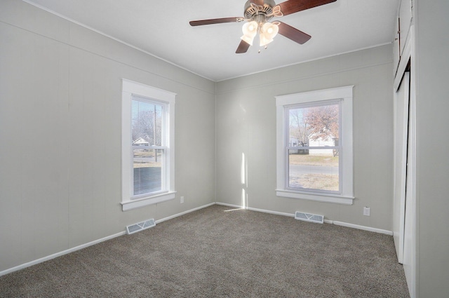 unfurnished room featuring carpet and ceiling fan