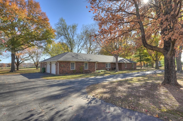 single story home featuring a garage