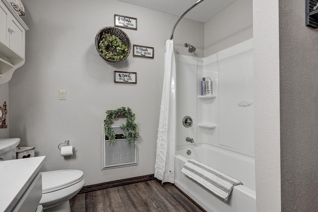 full bathroom featuring toilet, hardwood / wood-style floors, vanity, and shower / tub combo with curtain